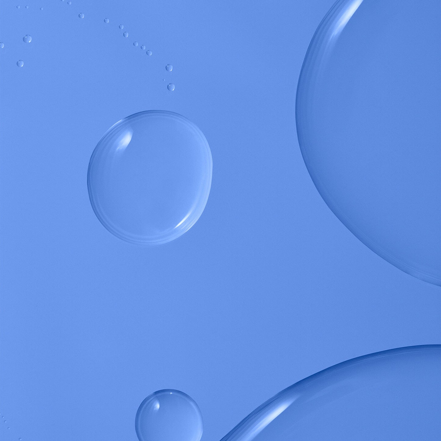 Transparent liquid over a blue background.