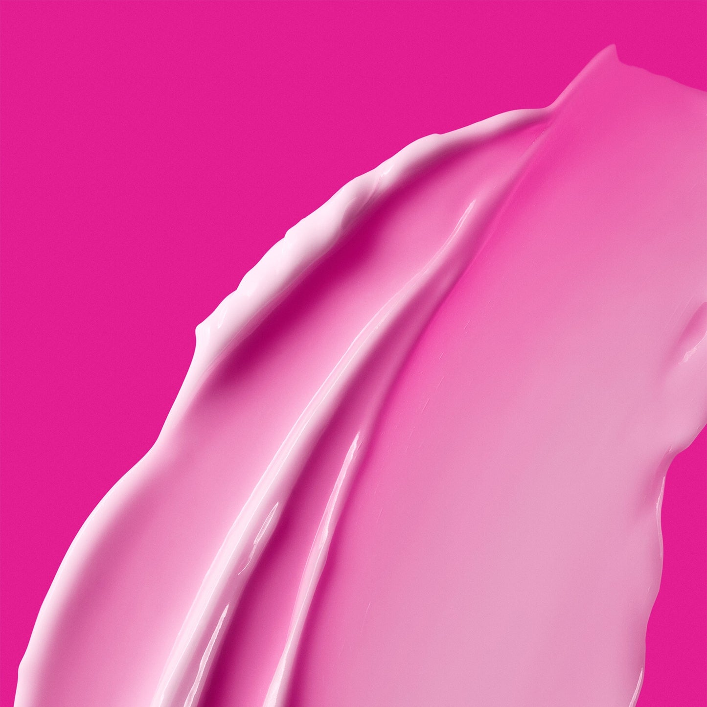 Thick pink skincare product with against a dark pink background.