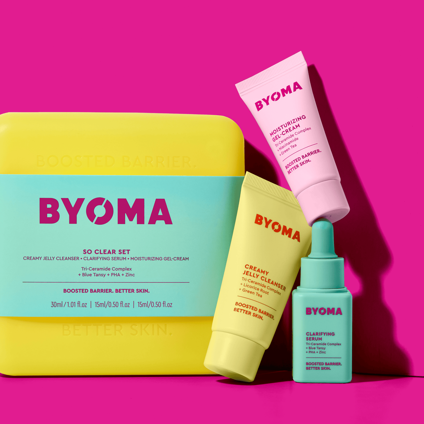 BYOMA SO CLEAR SET kit along with CREAMY JELLY CLEANSER, CLARIFYING SERUM and MOISTURIZING GEL CREAM against a pink background.