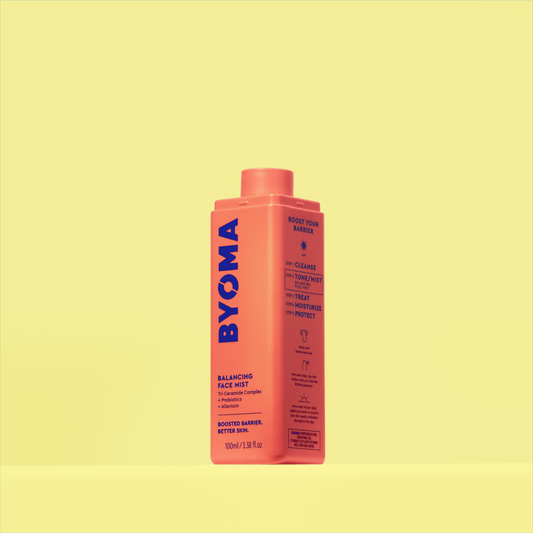 BYOMA BALANCING FACE MIST with no lid against a yellow background.