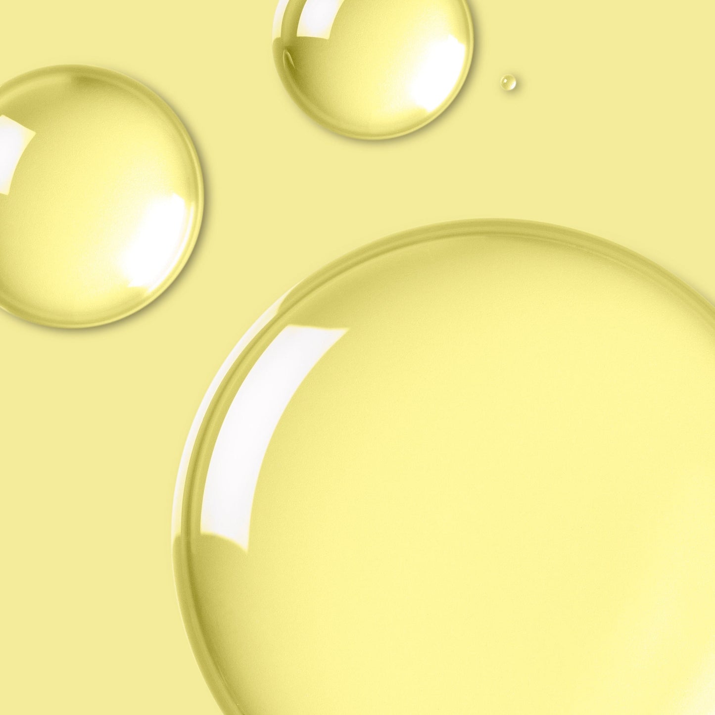 Transparent liquid on a yellow background.