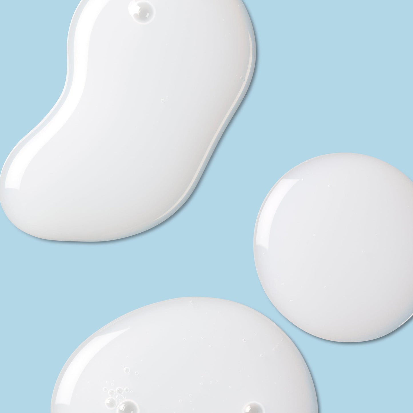 Milky white lotion against a blue background.