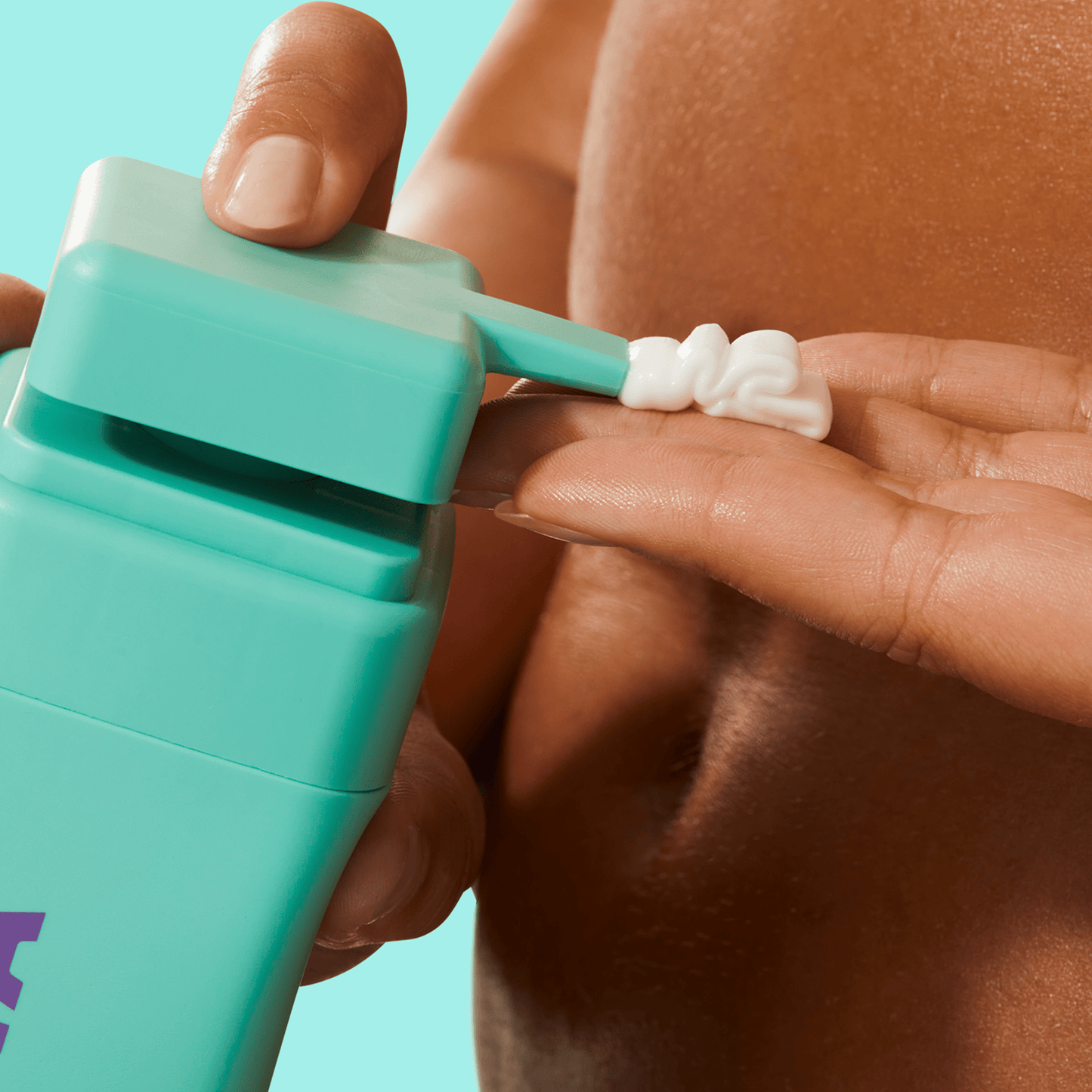 Closeup of a hand squeezing BYOMA product onto another hand.