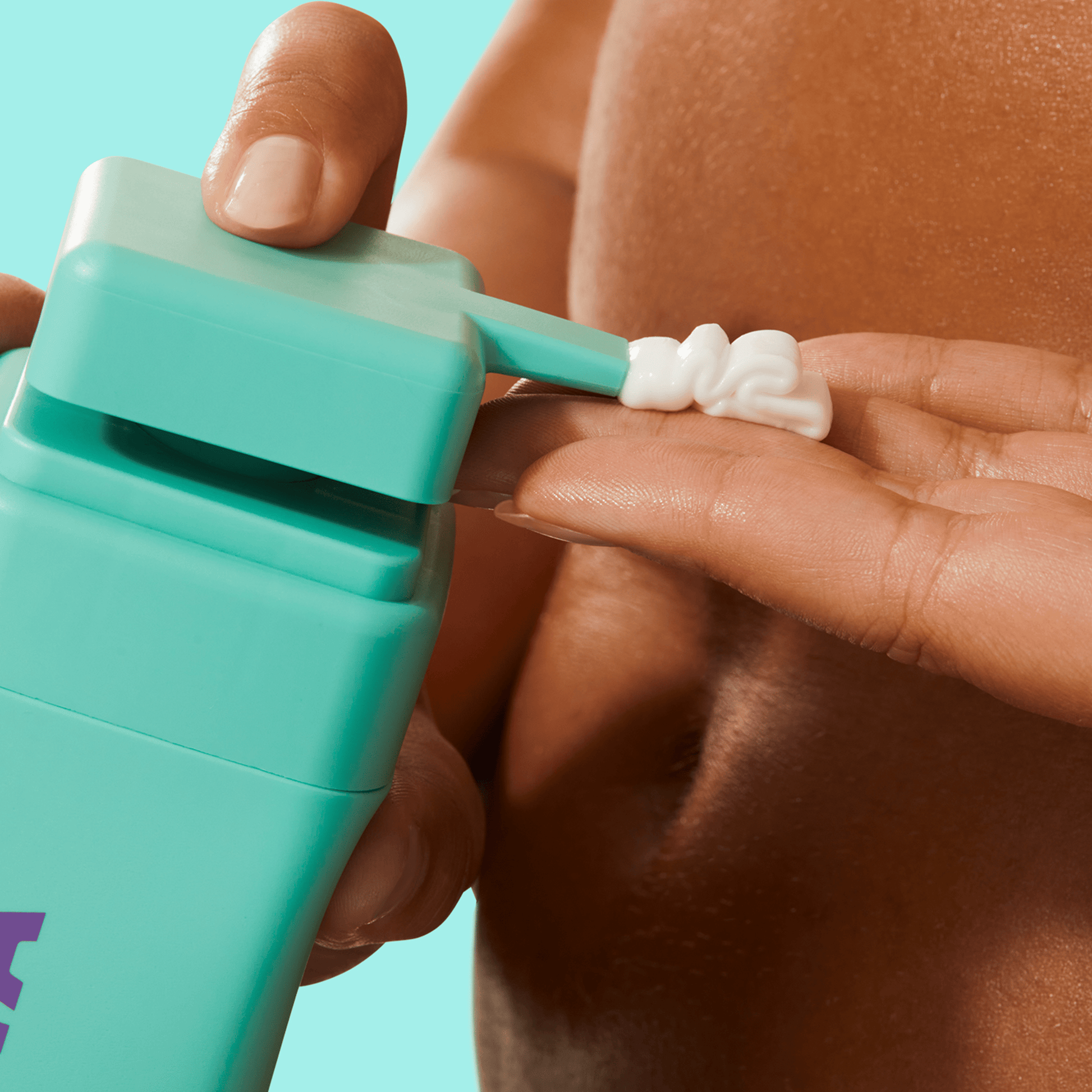 Closeup of a hand squeezing BYOMA product onto another hand.