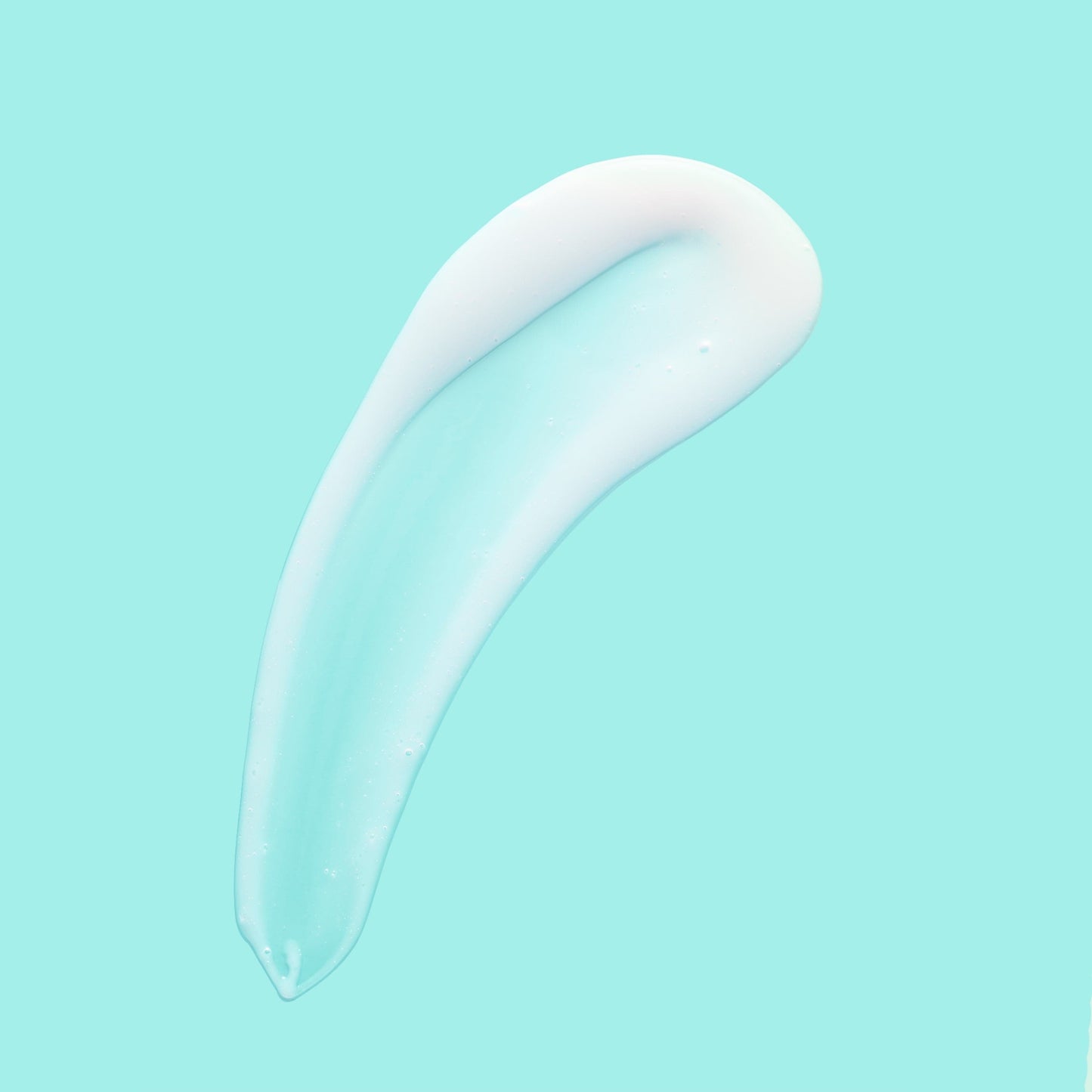 A streak of white cream against a blue background.
