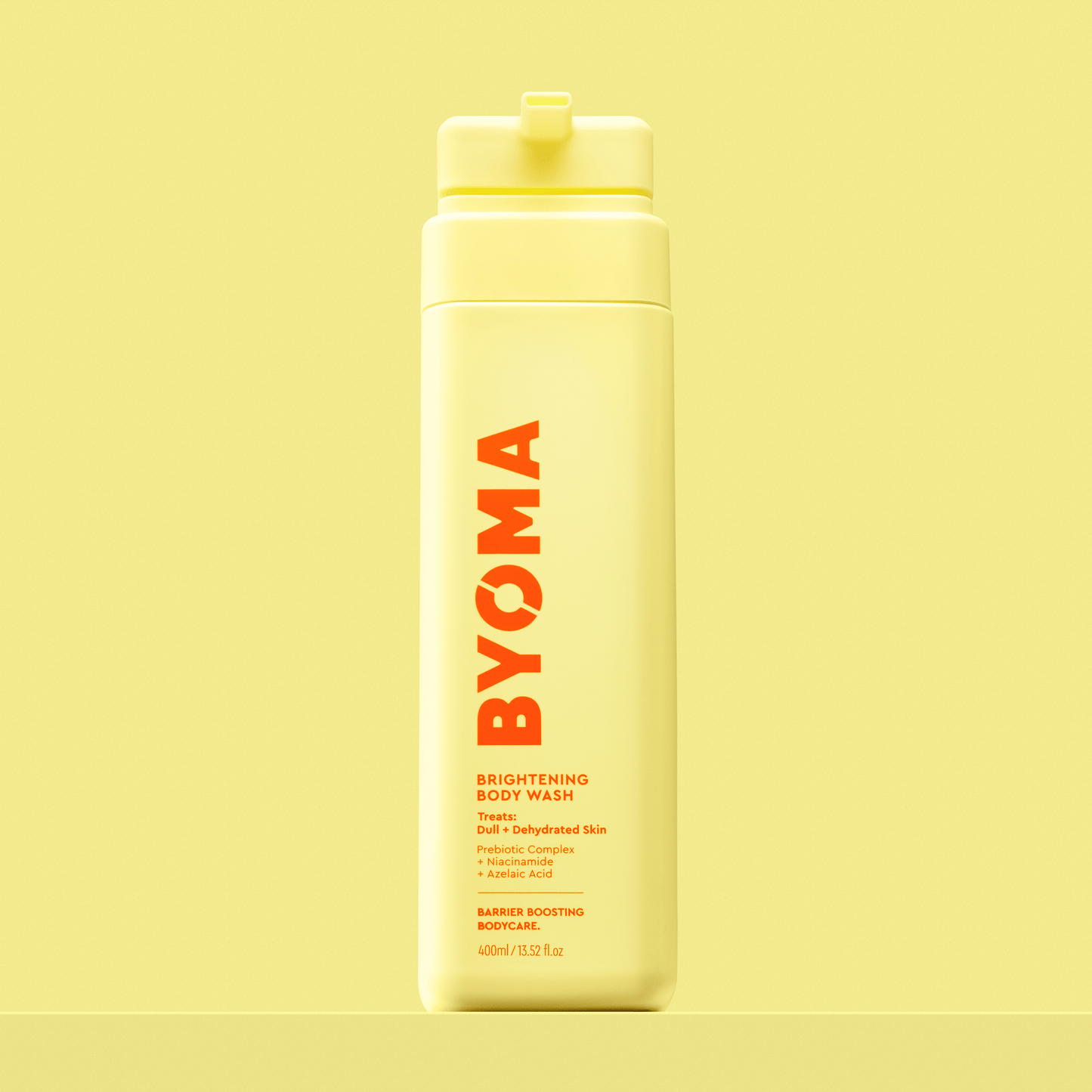 BYOMA BRIGHTENING BODY WASH against a yellow background.