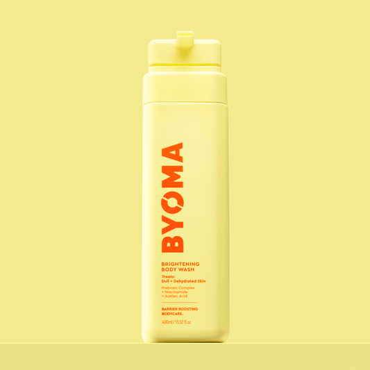 BYOMA BRIGHTENING BODY WASH against a yellow background.