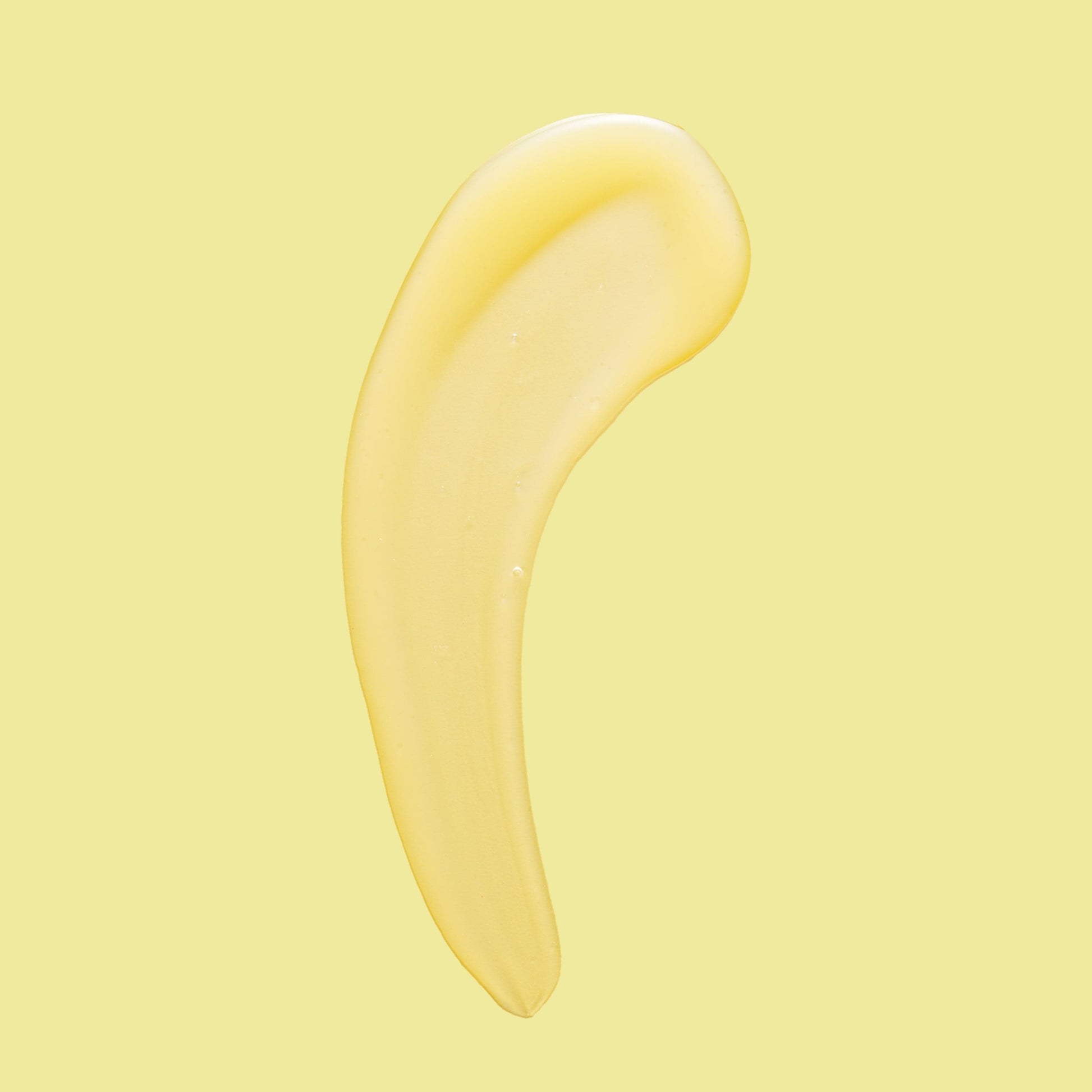 Yellow smear of product against a yellow background.