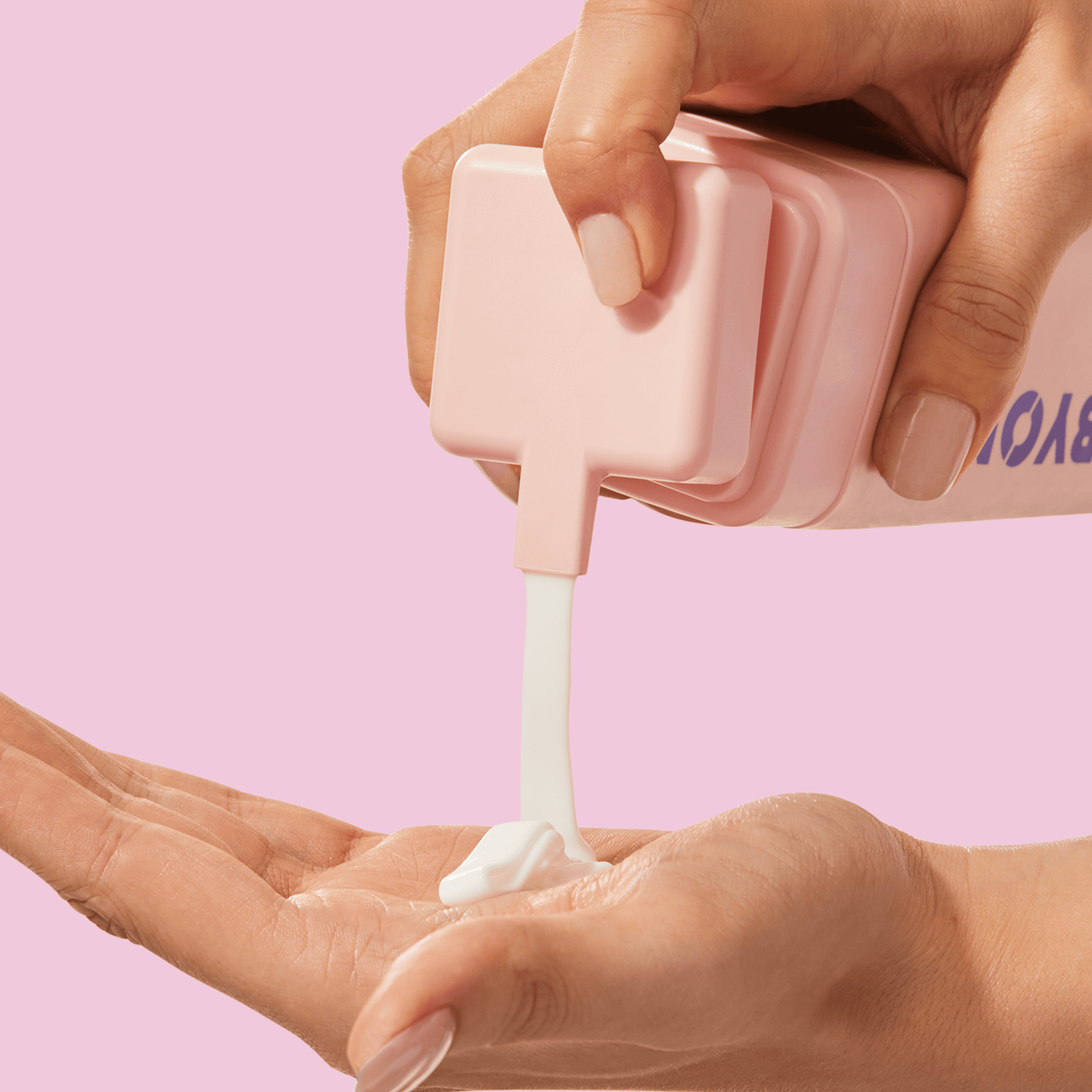 A woman squeezing BYOMA product from one hand to another.