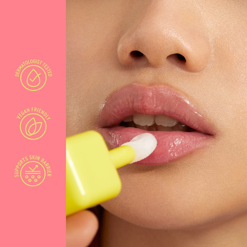 Person applying a pink lip balm with a yellow applicator on a pink background with icons and text.