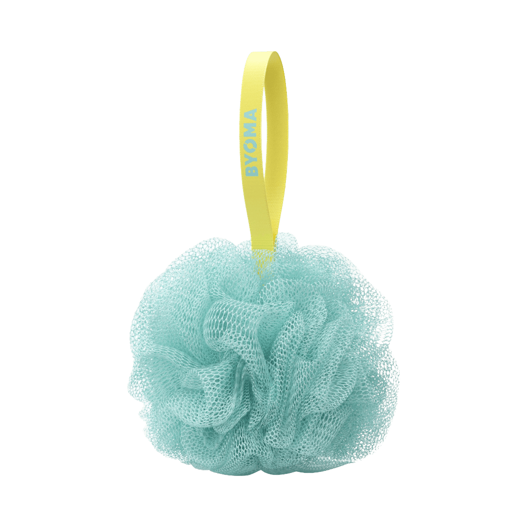Turquoise bath pouf with a yellow handle on a white background